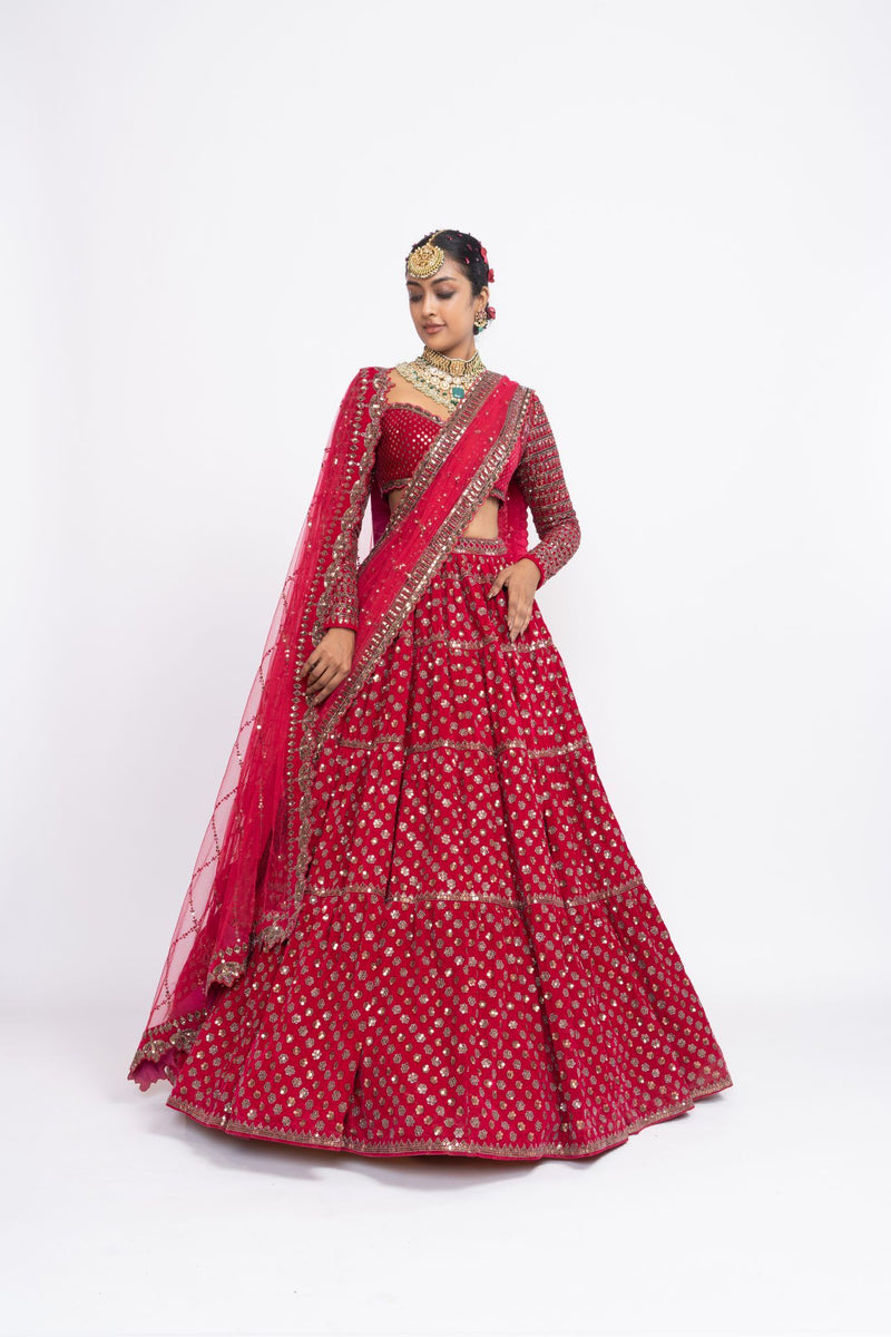 Red floral lehnga with sweetheart neck blouse and 2 embroidered dupattas.