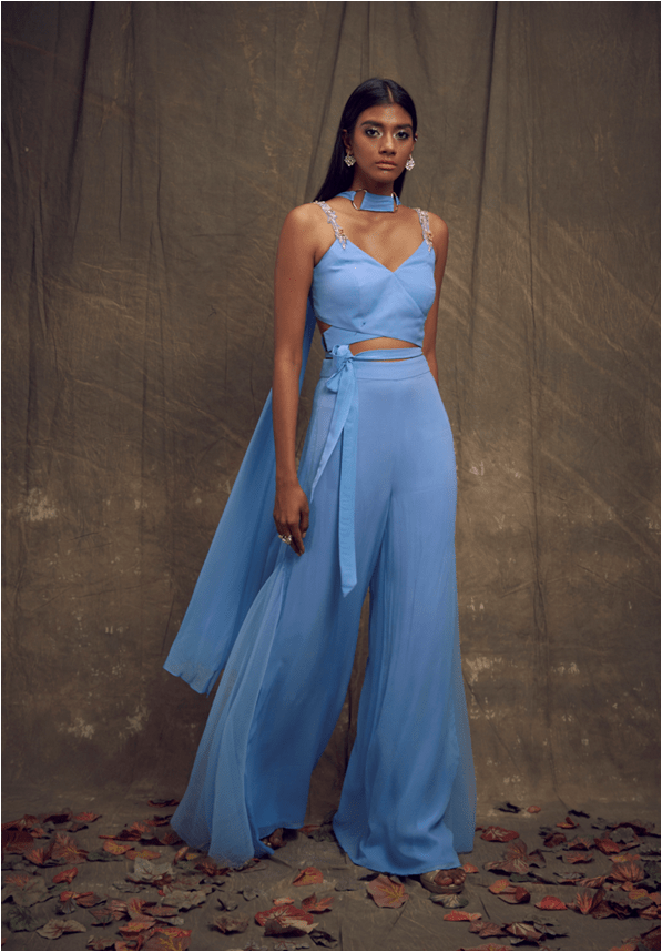 Light blue sleeveless overlap blouse with embellished straps + palazzo panys with pleated net side panels + georgette dupatta